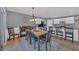 Elegant dining area with a large table, neutral paint, and ceramic tile flooring at 8969 Mondial Ct, Venice, FL 34293