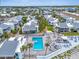 Overhead view of condos with a pool and nearby waterway in this lovely community at 902 Gibbs Rd # 181, Venice, FL 34285