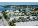 An overhead view shows condos near the water with boat docks and a convenient parking area at 902 Gibbs Rd # 181, Venice, FL 34285