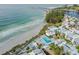 Aerial view showcasing beach access, pool area, and community layout, highlighting the coastal lifestyle at 902 Gibbs Rd # 181, Venice, FL 34285