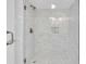 Clean bathroom features a glass-enclosed shower with tiled walls at 902 Gibbs Rd # 181, Venice, FL 34285