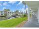 Waterfront condo complex with boat docks, lush landscaping, and a serene canal view at 902 Gibbs Rd # 181, Venice, FL 34285