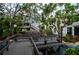 Picturesque walkway lined with tropical foliage leading to community condos at 902 Gibbs Rd # 181, Venice, FL 34285