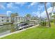 Waterfront condo complex featuring boat docks, lush lawns, and beautiful canal views at 902 Gibbs Rd # 181, Venice, FL 34285