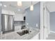 Well-lit kitchen with stainless steel appliances, stylish faucet, and plenty of counter space for meal preparation at 902 Gibbs Rd # 181, Venice, FL 34285