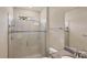 Modern bathroom featuring a glass shower enclosure and granite vanity top at 9916 Bright Water Dr, Englewood, FL 34223