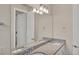 Bathroom featuring a double sink vanity with granite countertops at 9916 Bright Water Dr, Englewood, FL 34223