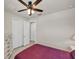 Cozy bedroom featuring a ceiling fan and a closet with double doors at 9916 Bright Water Dr, Englewood, FL 34223