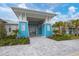 Stunning clubhouse entrance featuring modern architectural design and landscaping at 9916 Bright Water Dr, Englewood, FL 34223