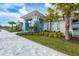 Beautiful clubhouse exterior with modern architecture and lush landscaping at 9916 Bright Water Dr, Englewood, FL 34223