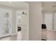 Hallway with an entry door and access to other rooms in the home at 9916 Bright Water Dr, Englewood, FL 34223