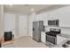 Kitchen showcasing white cabinets, stainless steel appliances, and plenty of counter space at 9916 Bright Water Dr, Englewood, FL 34223