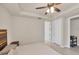 Spacious main bedroom features a ceiling fan, tray ceiling, and access to a closet and bathroom at 9916 Bright Water Dr, Englewood, FL 34223