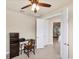 Bright office space with a ceiling fan and view to the living space at 9916 Bright Water Dr, Englewood, FL 34223