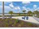 Community play area with sand and play equipment, surrounded by landscaping at 9916 Bright Water Dr, Englewood, FL 34223