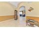 Inviting foyer featuring tile flooring and elegant decor that leads into a cozy living space at 1018 Yosemite Dr, Englewood, FL 34223