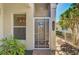 Welcoming front entrance featuring a screen door and lovely landscaping at 1018 Yosemite Dr, Englewood, FL 34223