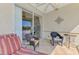 Relaxing screened lanai features tile flooring, ceiling fan, and comfortable seating for enjoying the outdoors at 1018 Yosemite Dr, Englewood, FL 34223