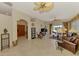 Bright living room featuring tile floors, comfortable seating, and a view of the lake at 1018 Yosemite Dr, Englewood, FL 34223