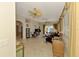 Spacious living room featuring tile floors, ceiling fans, and ample natural light at 1018 Yosemite Dr, Englewood, FL 34223