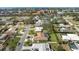 An aerial view of the residential area, highlighting the well-maintained yards and proximity to local amenities at 107 Corot Dr, Nokomis, FL 34275