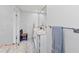 Bathroom featuring marble flooring, dual sinks, and a built-in towel rack at 107 Corot Dr, Nokomis, FL 34275