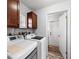Well-lit laundry room featuring washer and dryer hookups, white appliances, and ample storage space at 107 Corot Dr, Nokomis, FL 34275