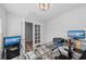 Office with a glass-top desk, french doors, wood-look floors, and overhead lighting at 107 Corot Dr, Nokomis, FL 34275