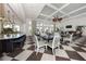 Dining room featuring a modern design with large windows and elegant decor, perfect for entertaining at 10768 Trophy Dr, Englewood, FL 34223
