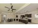 Open kitchen area featuring dark cabinetry, pendant lighting, and a dining area at 10768 Trophy Dr, Englewood, FL 34223