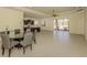 Open floorplan concept showcasing a kitchen, dining area, and living space with a screened patio in background at 10768 Trophy Dr, Englewood, FL 34223