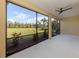 Relax on the screened in lanai with views of the lush landscaping, and enjoy the breeze from the ceiling fan at 10768 Trophy Dr, Englewood, FL 34223