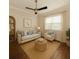 Cozy sitting room with neutral tones, natural lighting and wood flooring at 10768 Trophy Dr, Englewood, FL 34223