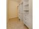 Walk-in closet with shelves and drawers at 10768 Trophy Dr, Englewood, FL 34223