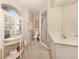 Well-lit bathroom featuring vanity with sink, toilet, and glass-enclosed shower at 1118 Southlake Ct, Venice, FL 34285