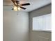 Bedroom with carpeted floors, closet, ceiling fan, and window at 1190 Longfellow Way # 135C, Sarasota, FL 34243