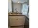 Kitchen sink with marble countertops, stainless steel appliances, and white cabinets and doors at 1190 Longfellow Way # 135C, Sarasota, FL 34243