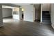 Open floor plan featuring new floors, gray walls, kitchen view, and gray carpet on the staircase at 1190 Longfellow Way # 135C, Sarasota, FL 34243
