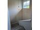 Staircase featuring neutral carpet, lighting fixture and a partial view of an adjacent window at 1190 Longfellow Way # 135C, Sarasota, FL 34243