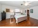 Cozy bedroom featuring a bed, hardwood floors, and a closet at 1200 Yawl Way, Venice, FL 34285