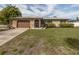Charming single-story home featuring a stone facade, well-maintained lawn, and inviting curb appeal at 1200 Yawl Way, Venice, FL 34285