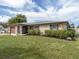 Charming single-story home with a well-manicured lawn and stone accents at 1200 Yawl Way, Venice, FL 34285