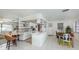 Bright kitchen with modern white cabinetry, quartz countertops, and an eat-in counter area at 1200 Yawl Way, Venice, FL 34285