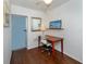 Home office area with desk, chair, hardwood floors, and natural light at 1200 Yawl Way, Venice, FL 34285