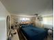 Bright bedroom featuring a ceiling fan, many windows, and built-in storage at 1228 Nantucket Rd, Venice, FL 34293