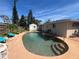 Inviting kidney-shaped pool with lounge chairs and lush greenery on a sunny day at 1228 Nantucket Rd, Venice, FL 34293