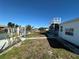 A spacious backyard with access to a canal and a quaint staircase leading to a viewing deck at 12613 4Th Isle, Hudson, FL 34667
