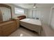 Bedroom featuring tile floors, ceiling fan, small closet, and natural light at 12613 4Th Isle, Hudson, FL 34667