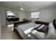 Bedroom featuring tile floors, ceiling fan, sliding mirror door closet and nice furniture at 12613 4Th Isle, Hudson, FL 34667