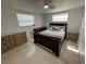 Bedroom featuring tile floors, ceiling fan and nice furniture at 12613 4Th Isle, Hudson, FL 34667